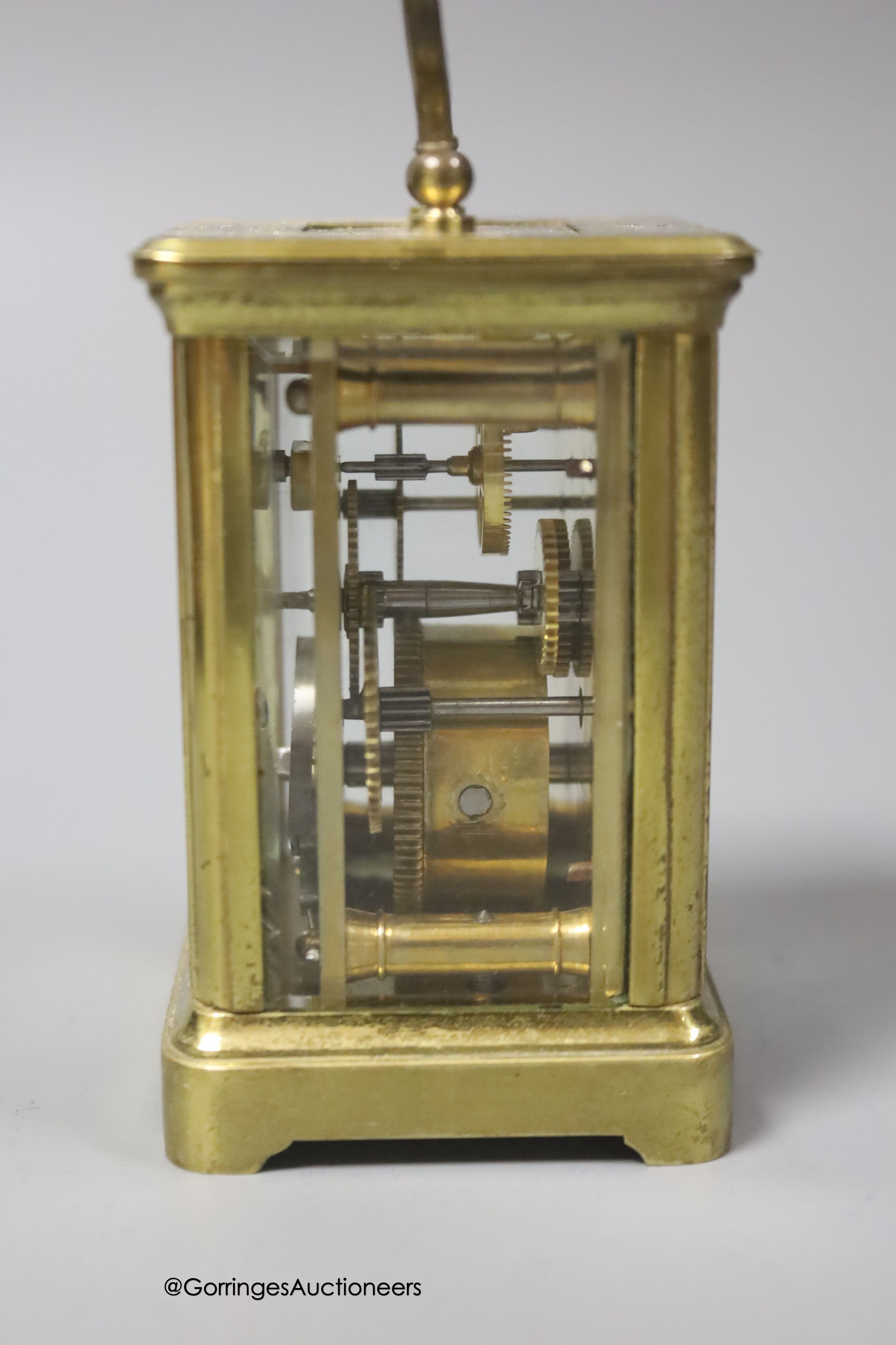 A brass cased carriage timepiece, 7.5cm, in a leather carrying case